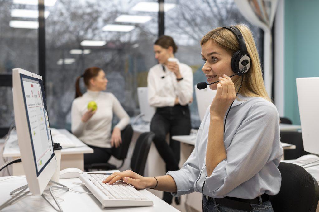 woman working call center talking with clients using headphones microphone