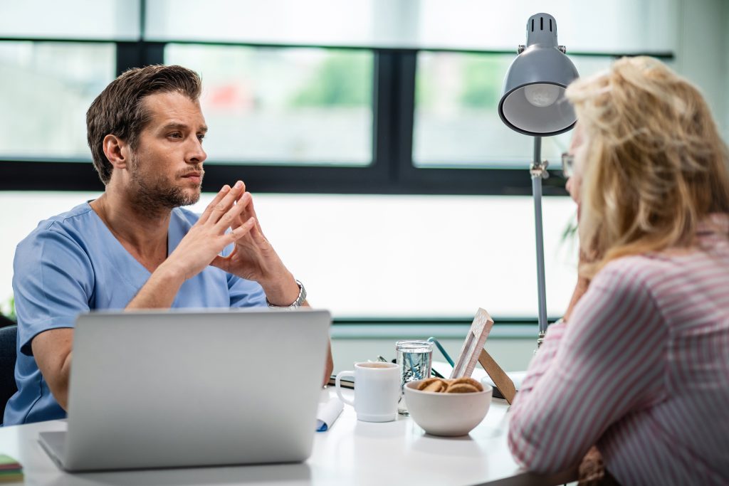 focused healthcare worker having consultations with female patient listening about her health issues Healthcare Appointment Setting: 9 Proven Strategies That Work