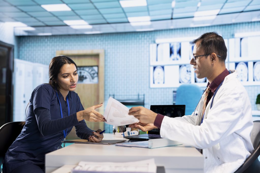 indian expert explaining diagnostics through test results with male patient Healthcare Appointment Setting: 9 Proven Strategies That Work