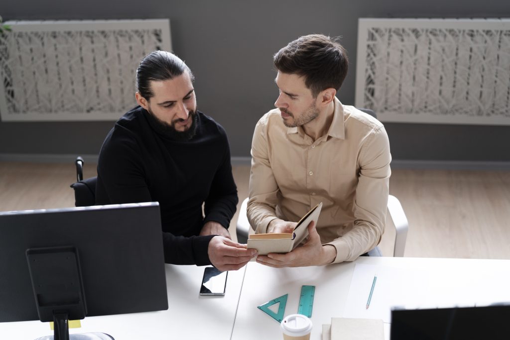 medium shot men working together Call Center vs SDR Agency: 7 Differences That Can Make or Break Your Sales