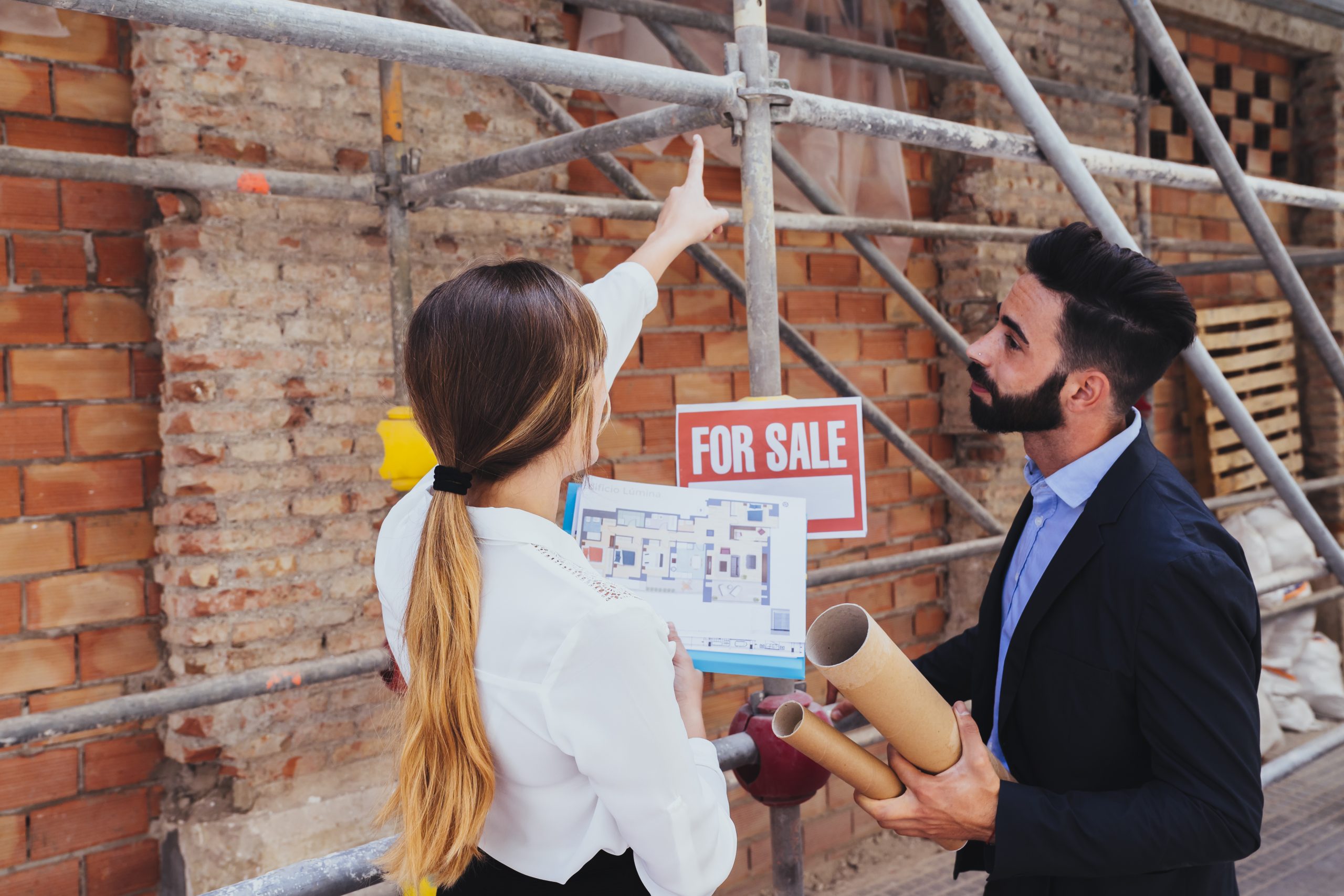 young real estate agents with scaffold background scaled Landscaping Companies