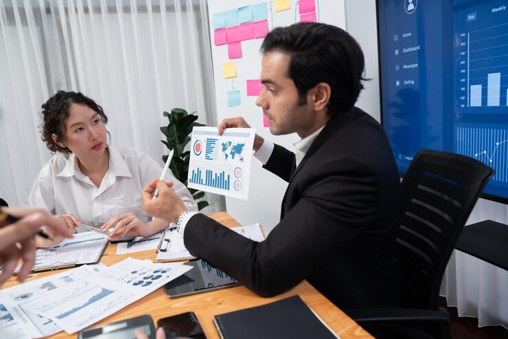 group business analyst team analyzing financial data report habiliment 31965 377436 Calculating Your Lead Generation ROI: 7 Smart Steps to Know What Works