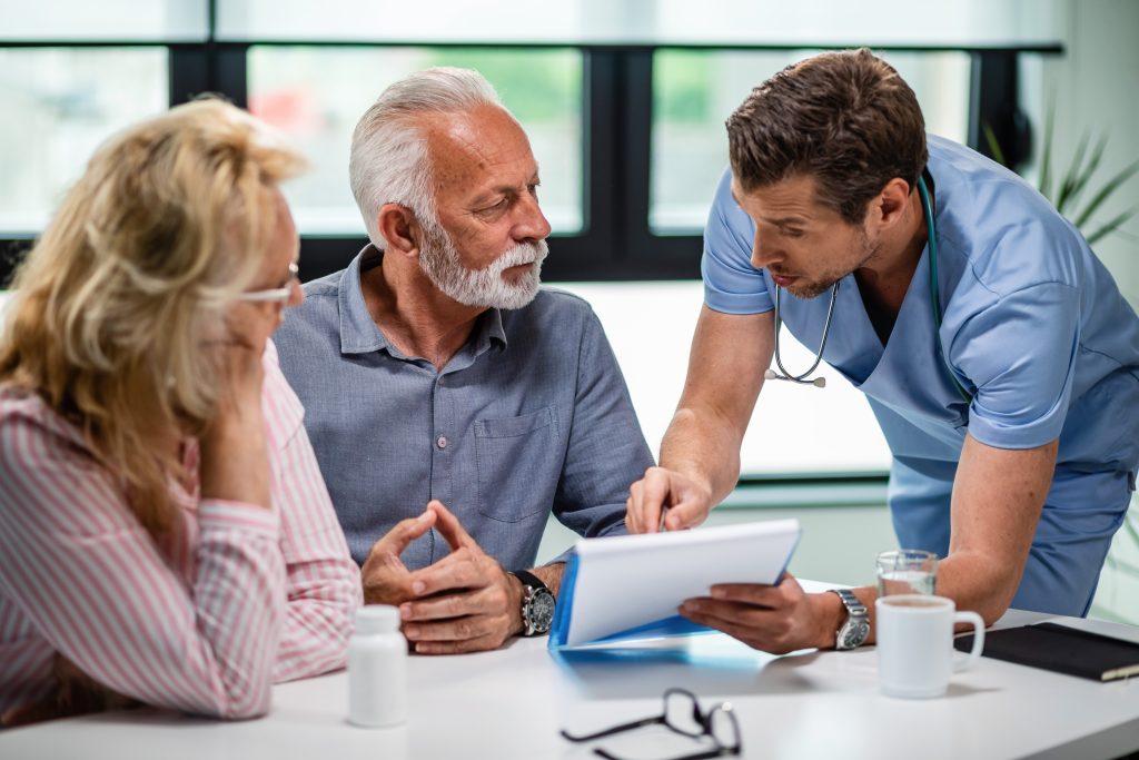 serious doctor discussing with senior couple about their medical documents appointment clinic How RapidCare Ambulance Won More Hospital Contracts