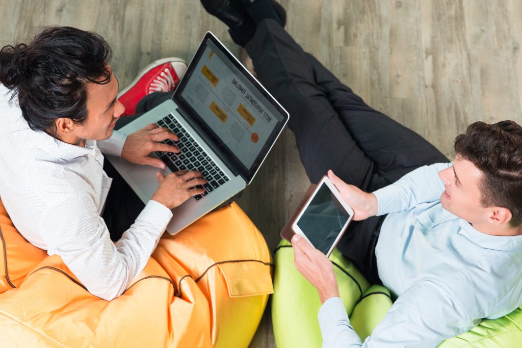 two business men working tablet laptop How EventPulse Entertainment Won Better Buyers With Appointment Setter Online